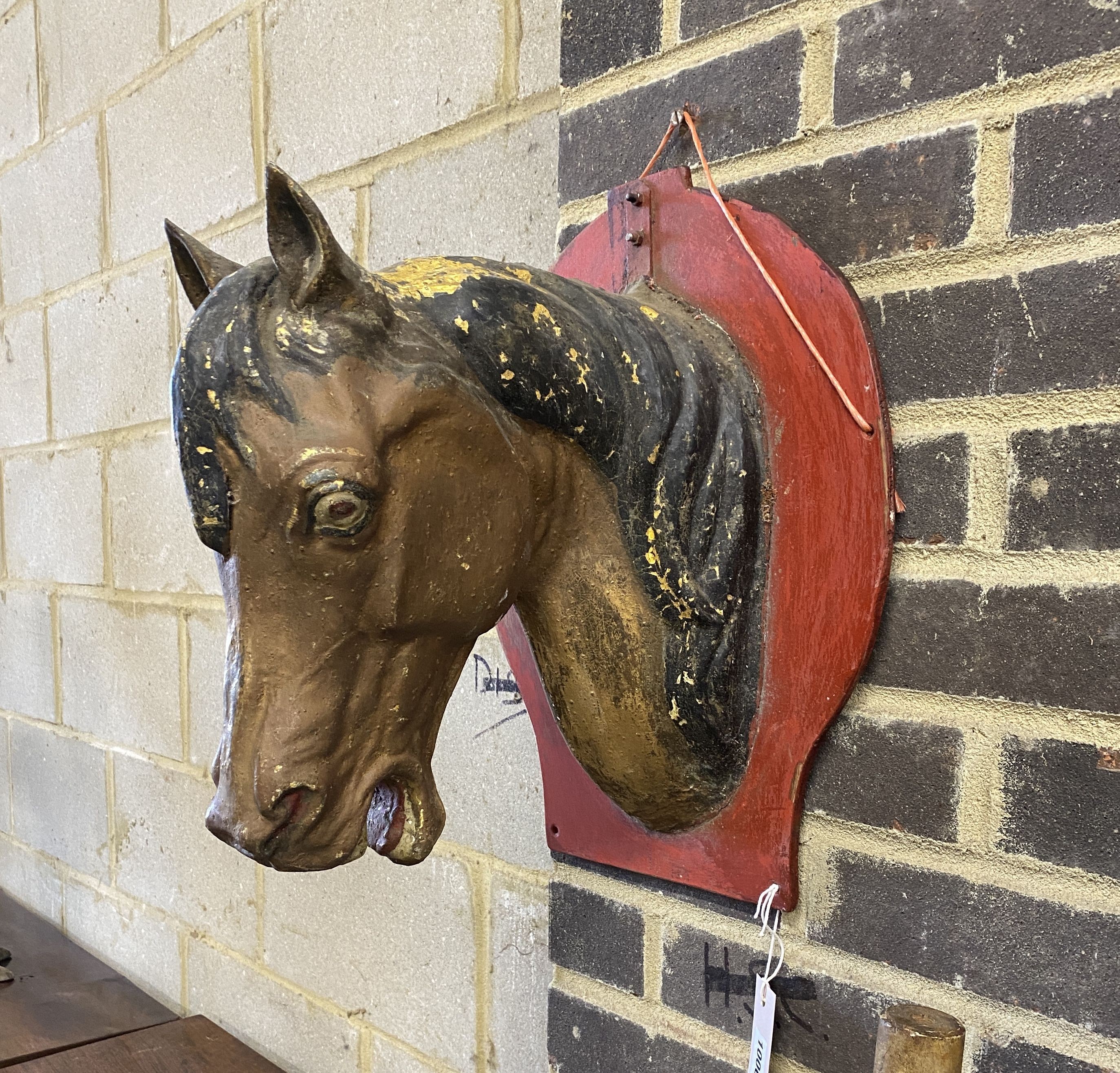 A vintage painted zinc horse head wall applique, height 43cm